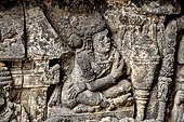 Prambanan - Ramayana reliefs on Shiva Temple. Details of Scene 9. Bharata (?) sits above offerings or foods prepared for a feast.  